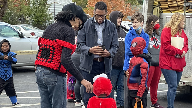 Pastor Todd talking with families at the trunk or treat.