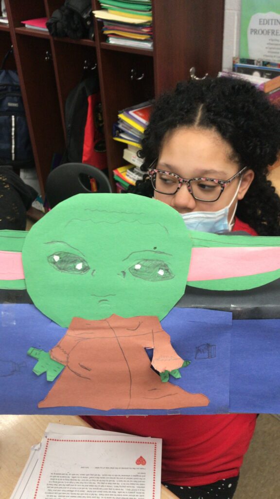 A student and her homemade valentine box.