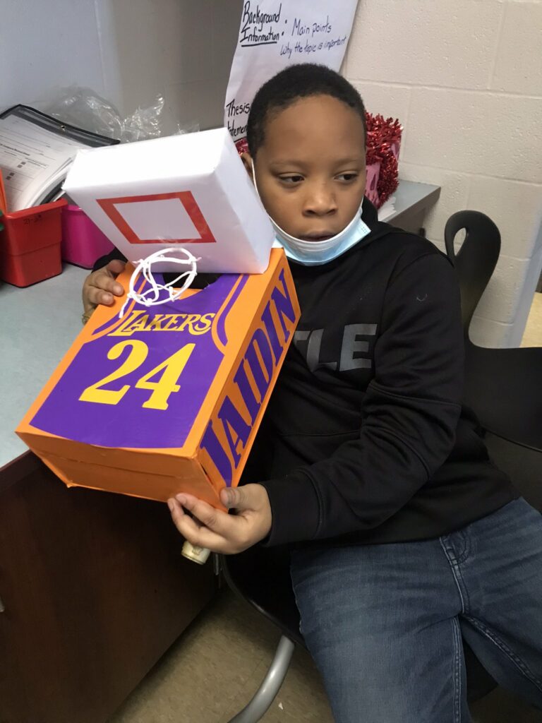 A student and his basketball themed valentine box.