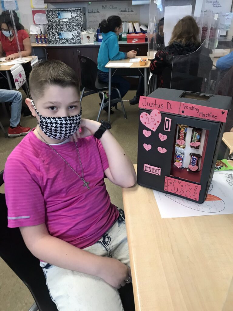 A student and his home made box.