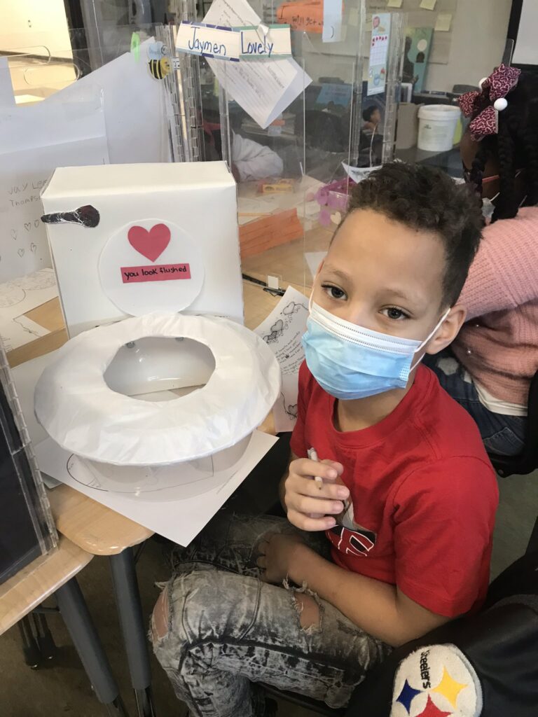 A student shows his Valentine's day box.