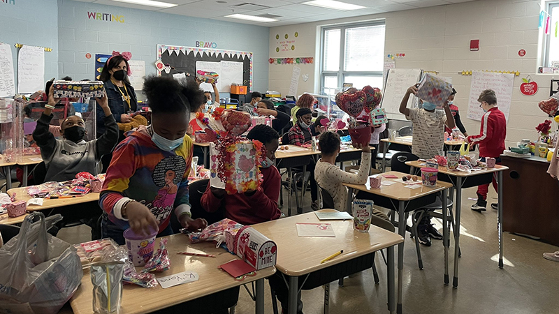 A classroom sharing valentines with each other.