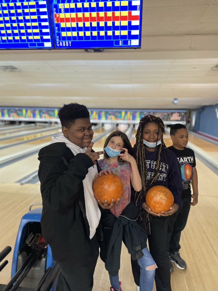 Students having fun bowling.