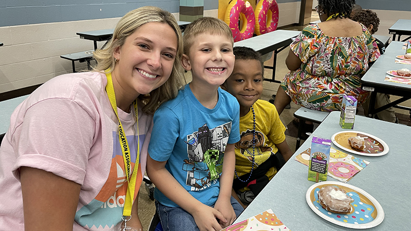 First graders enjoy their donut award with Miss Price.