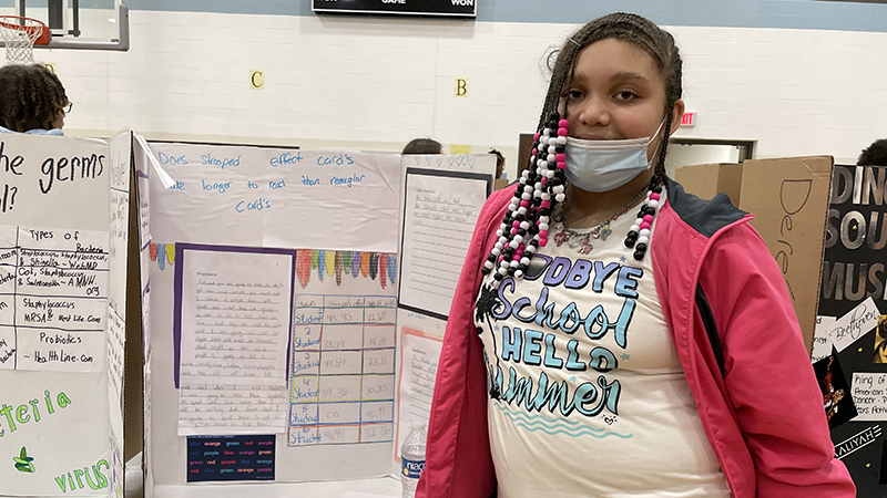 A student with their project about cords.