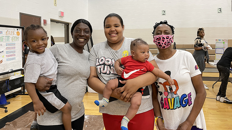 A sixth grader with their visiting family.