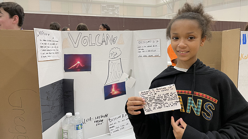 A student and their project about volcanoes.