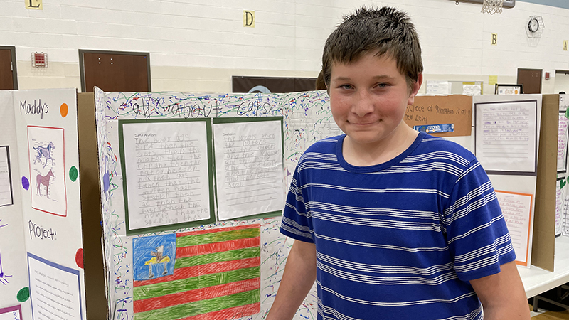 A student with his project about cars.