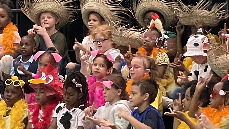 A group of first graders singing one of the songs.