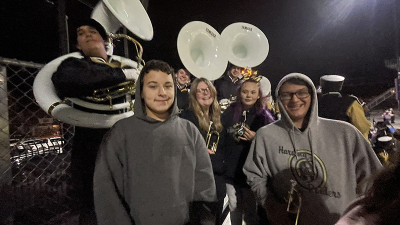 Eighth graders hanging with Harding band members in between playing stand tunes.
