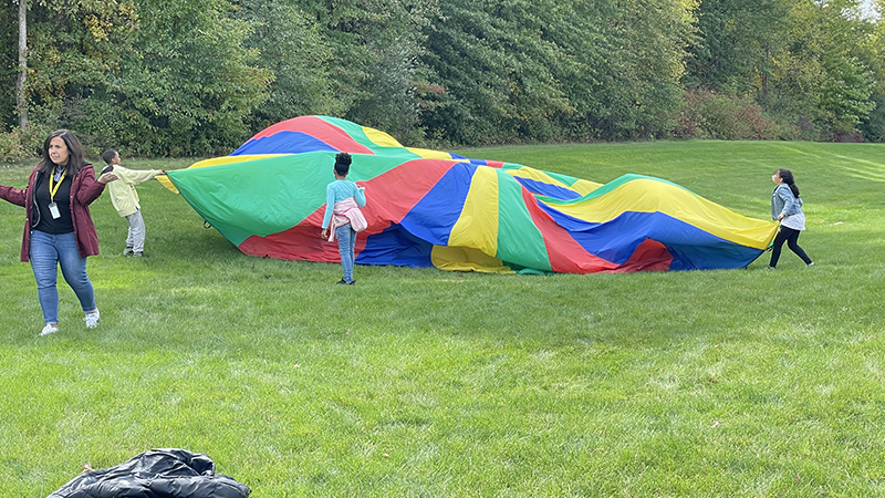 Fourth graders enjoying the parachute.