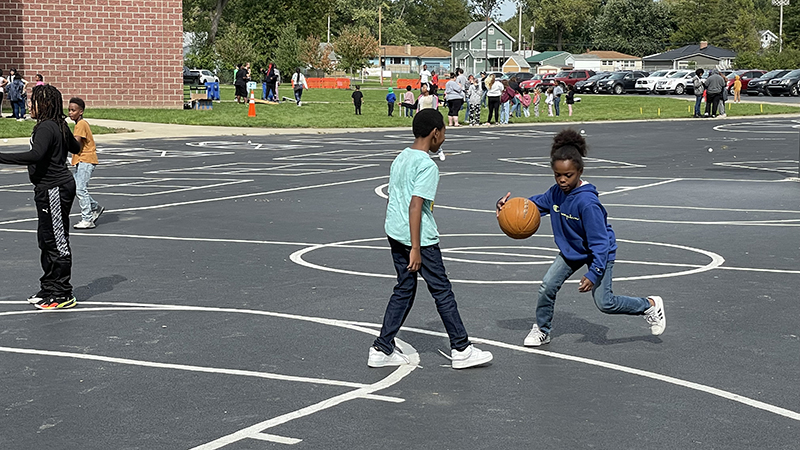 Students on the basketball court.
