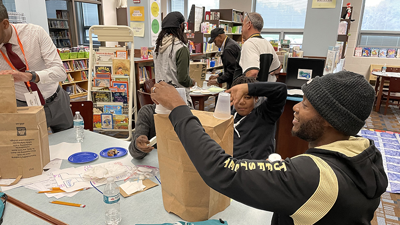 Students and mentors having fun building their castle.