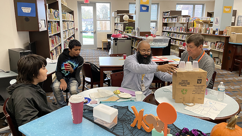 Students and mentors work together to build a castle.