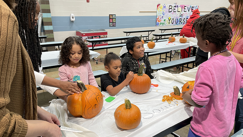 Students working on their pumpkins.