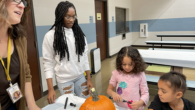 A kindergarten student with her helper.