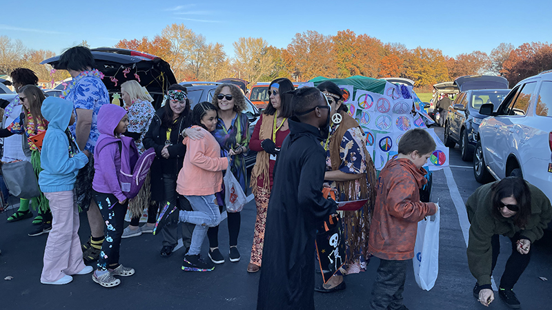 Fourth grade teachers passing out candy.