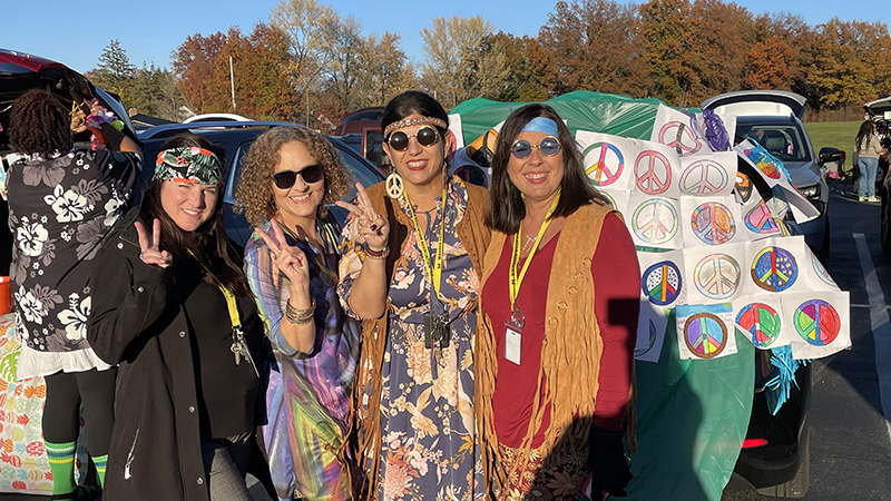 Fourth grade teacher having fun at trunk or treat.