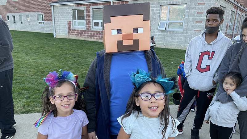 A family in line ready for trunk or treat.