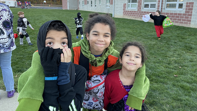 A family in line ready for trunk or treat.