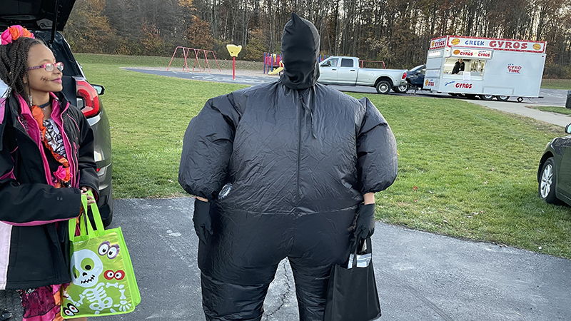 A student dressed for trunk or treat