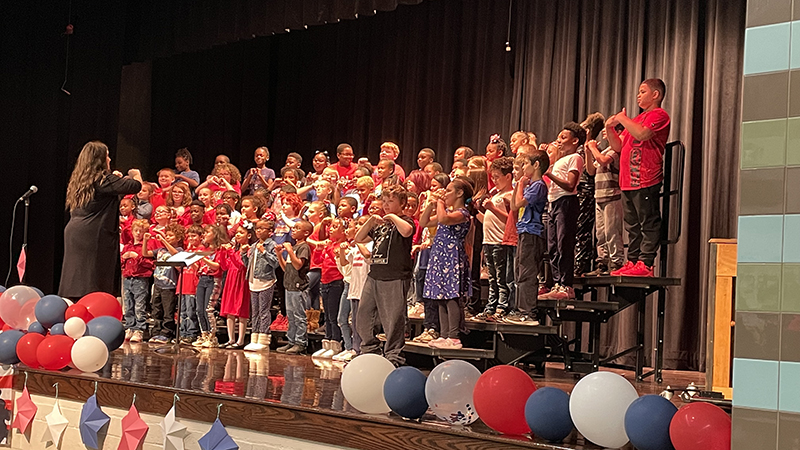 Third graders giving a great performance on stage.