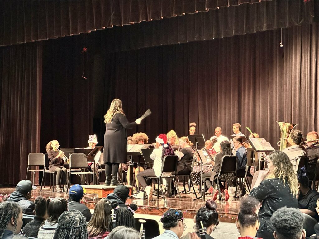 band students on stage performing one of their pieces.