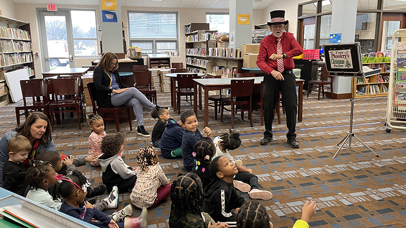 Students watch the magic show.