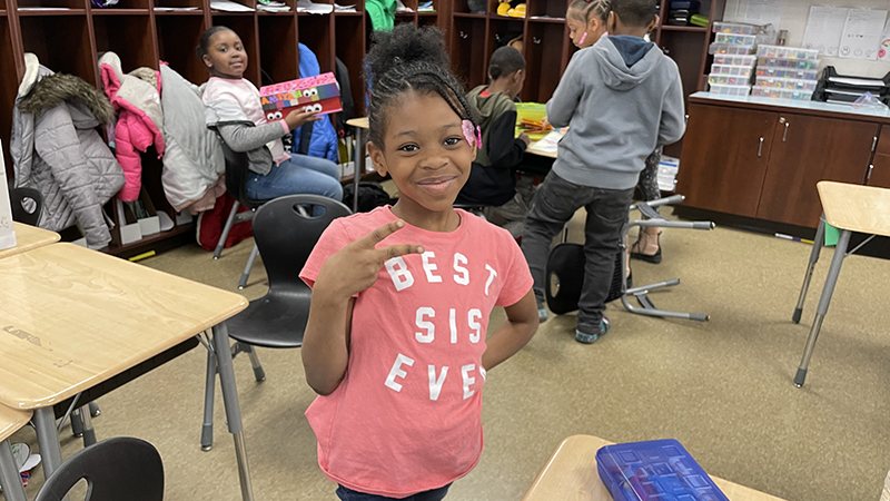 A student enjoying the classroom party.