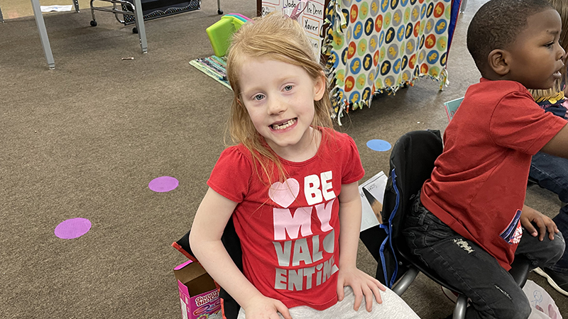 A student shows her Valentine's Day shirt.