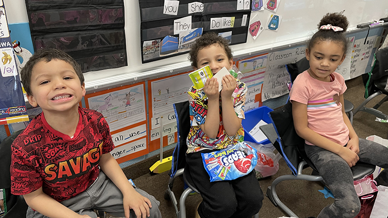 A student shows some of the Valentines he got from his friends.