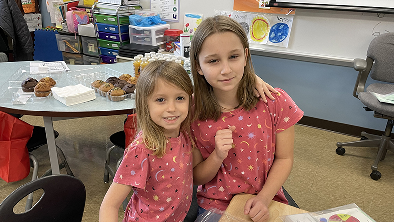 A first grader had her big sister as her special guest.
