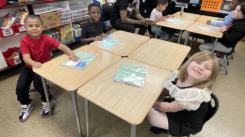 First graders waiting to start their game.