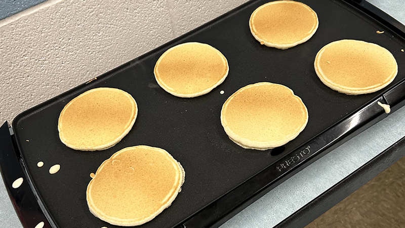 Pancakes on a griddle.