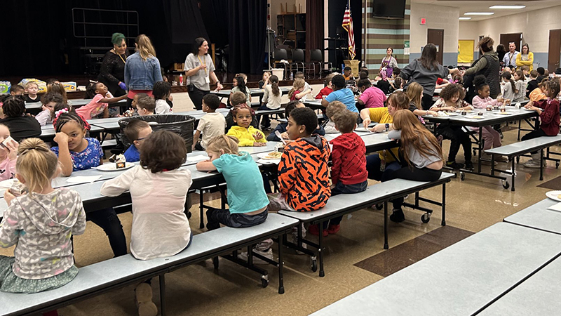 Students enjoy their pancake reward breakfast in the cafeteria.