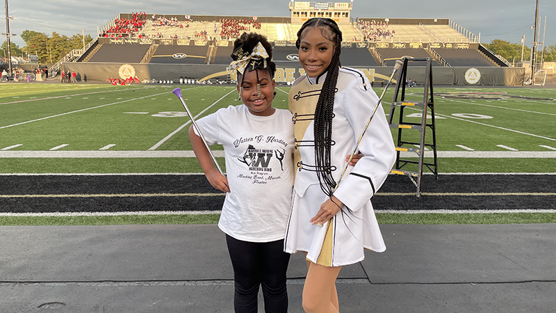 Jefferson student with a high school majorette.