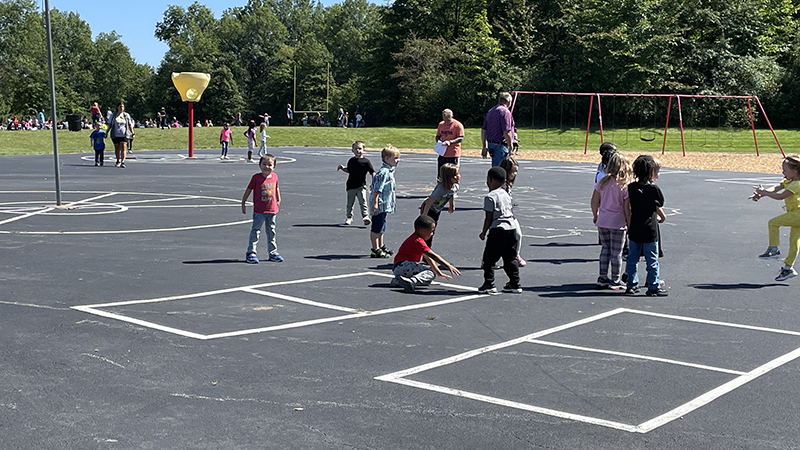 Students play and dance.