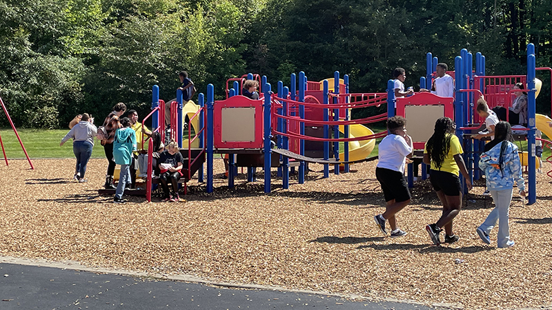 Students at the playground during the tailgate party.