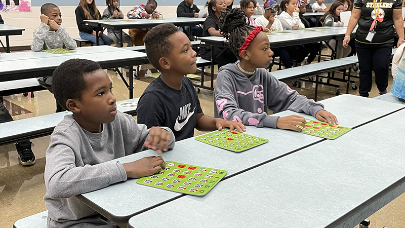 Fourth graders listen for the next bingo number.