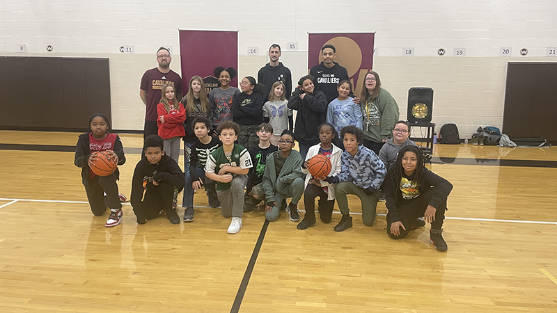 Mrs. Jenkins' fifth grade class getting their picture with the Cavs Academy representatives.