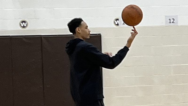 A representative from the Cavs Academy shows off a trick.