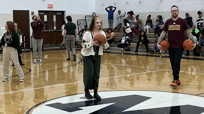 Miss Adams attempts a half court shot.