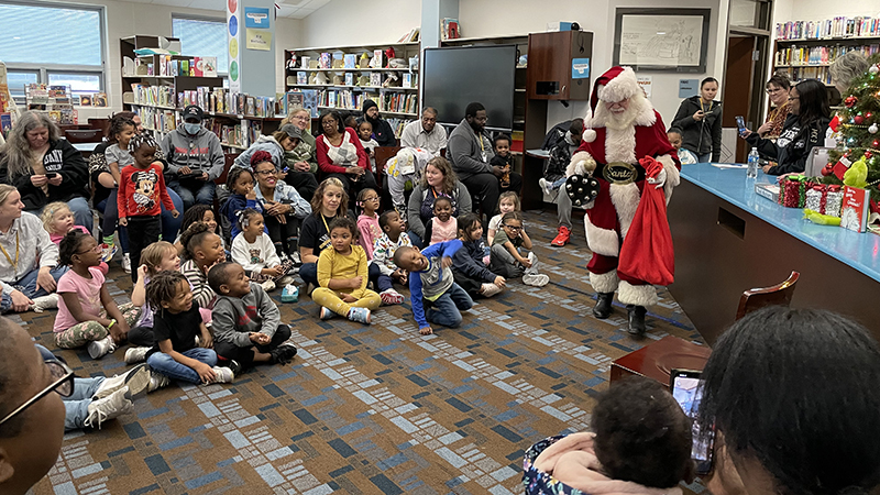 Santa surprises the students.