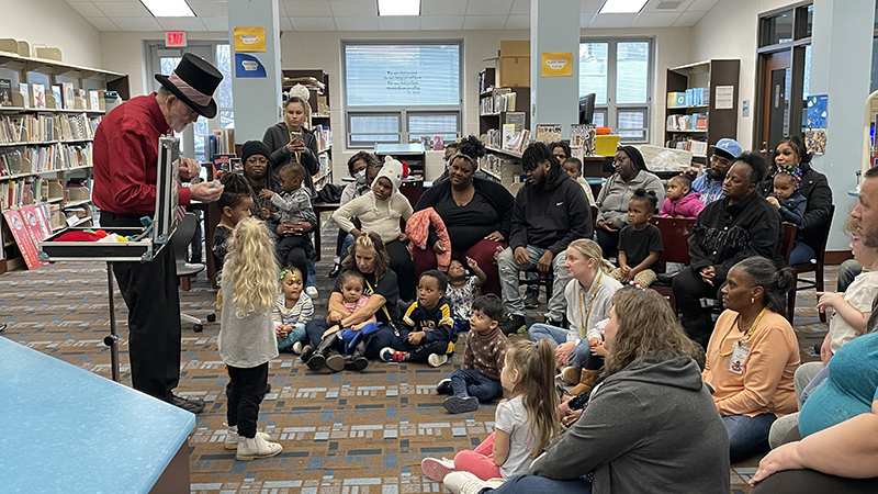 A student helps with a magic trick.