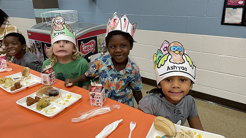 Kindergarteners made hats for the occasion.