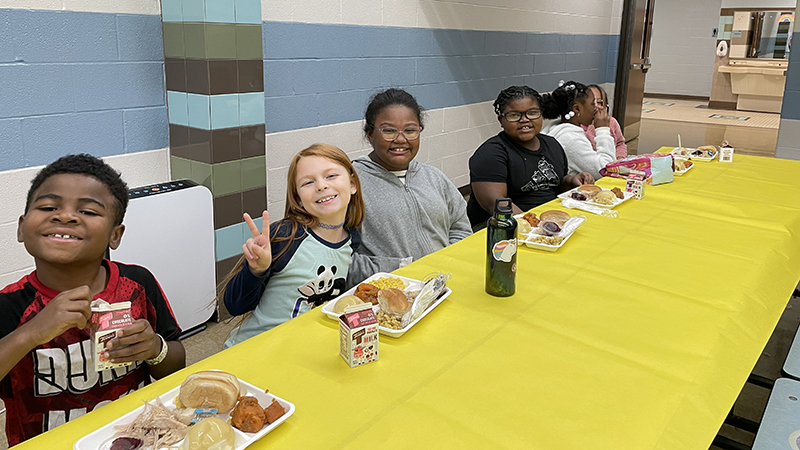 Students enjoying their meal together.