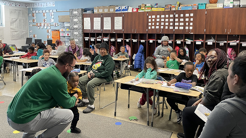 Mr. Bitner and his class greet their guests.