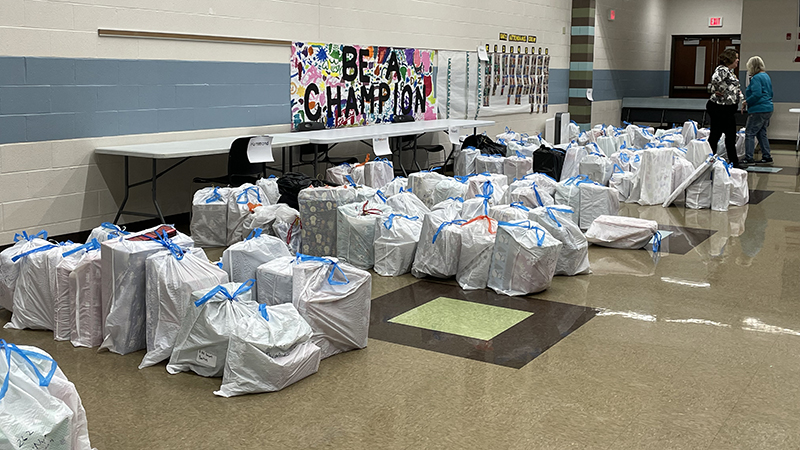 Just some of the many bags of gifts given to students.