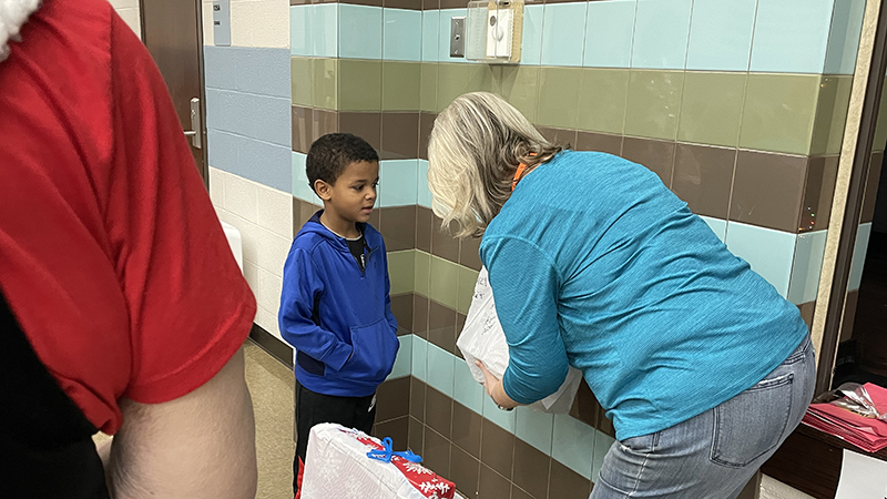 A student receives his gifts.