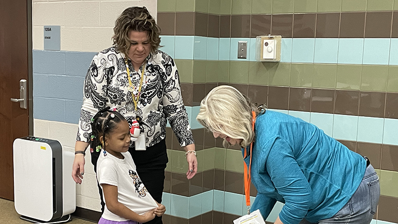 A student receives her gifts.